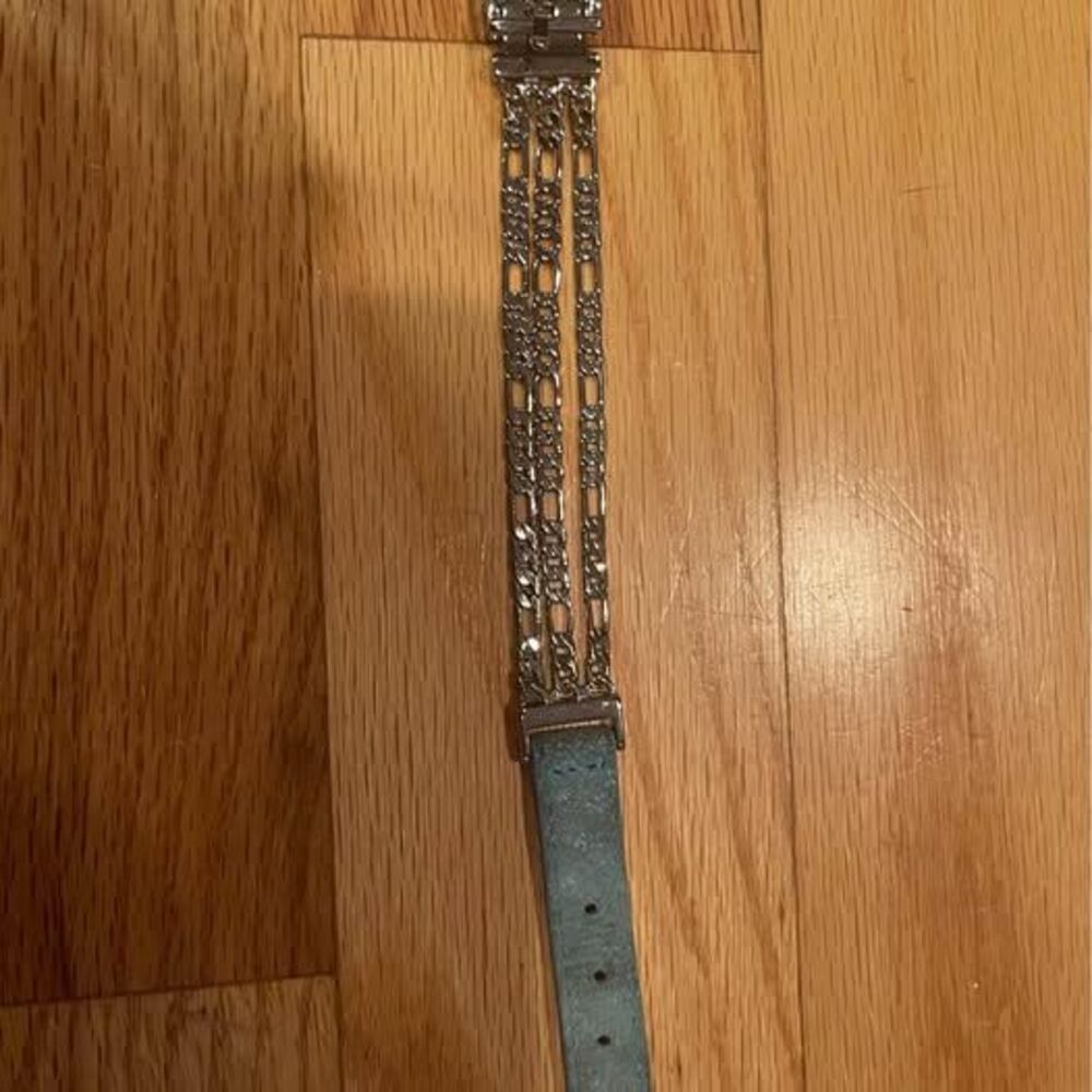 teal and silver colored bracelet with chains